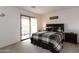 Bedroom with sliding glass doors to a patio, neutral carpet, and wood furniture at 2749 S Powell Rd, Apache Junction, AZ 85119