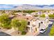 Two-story home with a tile roof, desert landscaping and mountain views at 2749 S Powell Rd, Apache Junction, AZ 85119