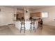 Kitchen island with breakfast bar, granite countertops, and ample cabinet space at 2749 S Powell Rd, Apache Junction, AZ 85119