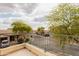 Overlooking the neighborhood with trees, homes, and a cloudy sky in the background at 2749 S Powell Rd, Apache Junction, AZ 85119