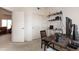 Spacious office area with doorway to the living room and adjacent closet for storage at 2749 S Powell Rd, Apache Junction, AZ 85119