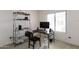 Bright office space featuring a large window, computer setup, and ample storage shelving at 2749 S Powell Rd, Apache Junction, AZ 85119