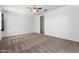 This bedroom offers carpet floors, neutral walls, a ceiling fan and an attached closet at 28259 N Chalcocite St, San Tan Valley, AZ 85143