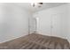 A bedroom featuring neutral carpet, white walls and doors, and ceiling fan at 28259 N Chalcocite St, San Tan Valley, AZ 85143