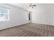 This bedroom includes carpet floors, neutral walls and two windows providing natural light at 28259 N Chalcocite St, San Tan Valley, AZ 85143