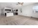 Open-concept living area features a ceiling fan, tile and carpet flooring and plenty of natural light at 28259 N Chalcocite St, San Tan Valley, AZ 85143