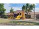 A vibrant community playground with colorful equipment, a secure fence, and a grassy area at 28259 N Chalcocite St, San Tan Valley, AZ 85143
