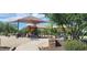 A fun community playground with various structures, slides, and sun shades for safe outdoor activities at 28259 N Chalcocite St, San Tan Valley, AZ 85143
