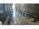 Spin room offers a line of exercise bikes on a polished floor with exposed brick walls at 28259 N Chalcocite St, San Tan Valley, AZ 85143
