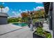 Stunning backyard featuring a refreshing pool, cozy seating, lush greenery, and outdoor kitchen at 3425 N 50Th Pl, Phoenix, AZ 85018