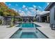 Expansive backyard featuring a modern pool, an outdoor seating area, and a fire pit at 3425 N 50Th Pl, Phoenix, AZ 85018