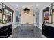 Beautiful bathroom showcasing dual vanities, a freestanding tub, and decorative tile accents at 3425 N 50Th Pl, Phoenix, AZ 85018