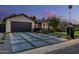 Modern driveway with concrete pavers separated by grass, leading to an attached garage at 3425 N 50Th Pl, Phoenix, AZ 85018