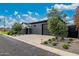 Contemporary home with well-maintained landscaping, a gated entrance, and a concrete driveway at 3425 N 50Th Pl, Phoenix, AZ 85018
