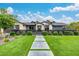 A beautiful home featuring a well-manicured lawn and modern pathway at daytime at 3425 N 50Th Pl, Phoenix, AZ 85018