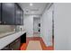 Hallway featuring a pantry, stackable washer and dryer, and sleek countertop space at 3425 N 50Th Pl, Phoenix, AZ 85018