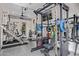 Bright home gym with multiple machines, mirrored wall, and rubberized flooring at 3425 N 50Th Pl, Phoenix, AZ 85018