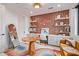 Bright home office featuring custom built-ins, designer wallpaper and whimsical decor at 3425 N 50Th Pl, Phoenix, AZ 85018