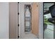 Convenient built-in ironing board cabinet beside the exercise room and view to the backyard pool at 3425 N 50Th Pl, Phoenix, AZ 85018