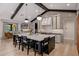 Bright and open kitchen features a large island with seating, wood beams and an open floorplan at 3425 N 50Th Pl, Phoenix, AZ 85018