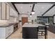Spacious kitchen with marble island, high-end appliances, wood beams, and an open floor plan at 3425 N 50Th Pl, Phoenix, AZ 85018