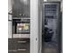 Dacor wine fridge with nearby home automation rack in a home with modern smart technology at 3425 N 50Th Pl, Phoenix, AZ 85018