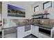 Modern kitchenette featuring stainless steel appliances and stylish backsplash at 3425 N 50Th Pl, Phoenix, AZ 85018