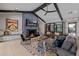 Stylish living room with a cozy fireplace, modern decor, and ample seating for entertaining at 3425 N 50Th Pl, Phoenix, AZ 85018