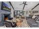 Bright living room featuring a cozy fireplace, large seating area, and seamless flow to other spaces at 3425 N 50Th Pl, Phoenix, AZ 85018
