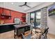 Bright home office with built-in desk, accent wall, and sliding door to outdoor space at 3425 N 50Th Pl, Phoenix, AZ 85018