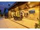 Under-covered outdoor patio featuring a dining area, fireplace, and sliding glass doors at 3425 N 50Th Pl, Phoenix, AZ 85018