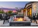Inviting patio with a stone fire pit and comfortable seating, perfect for outdoor entertaining at 3425 N 50Th Pl, Phoenix, AZ 85018