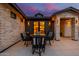 Cozy outdoor dining area on a patio with modern furniture and stylish exterior lighting at 3425 N 50Th Pl, Phoenix, AZ 85018