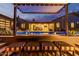 Outdoor patio with a built-in bar, cozy seating, and a view of the pool and outdoor entertainment area at 3425 N 50Th Pl, Phoenix, AZ 85018