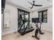 Well-lit workout room featuring modern exercise equipment, hardwood floors, and outdoor views at 3425 N 50Th Pl, Phoenix, AZ 85018