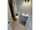 Bathroom featuring gray vanity with new faucet and new flooring at 3840 N 43Rd Ave # 71, Phoenix, AZ 85031