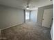 Large bedroom with updated flooring, ceiling fan and closet at 3840 N 43Rd Ave # 71, Phoenix, AZ 85031