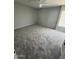 Spacious bedroom with gray walls, neutral carpet, a ceiling fan, and a window at 3840 N 43Rd Ave # 71, Phoenix, AZ 85031