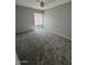 Large bedroom with neutral carpet, ceiling fan, and window with blinds at 3840 N 43Rd Ave # 71, Phoenix, AZ 85031