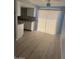 Bright dining room with sliding glass doors and wood-style flooring at 3840 N 43Rd Ave # 71, Phoenix, AZ 85031