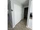 Hallway with wood-look flooring and white closet doors at 3840 N 43Rd Ave # 71, Phoenix, AZ 85031
