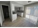 Bright kitchen and dining area featuring new cabinets and stainless steel appliances at 3840 N 43Rd Ave # 71, Phoenix, AZ 85031