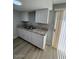 Modern kitchen features granite countertops, new cabinets, stainless steel appliances, and new flooring at 3840 N 43Rd Ave # 71, Phoenix, AZ 85031