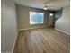 Bright living room featuring new floors, a large window, and a ceiling fan at 3840 N 43Rd Ave # 71, Phoenix, AZ 85031