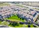 Community aerial view featuring green space, sidewalks, pool and landscaping nestled within a beautiful neighborhood at 3855 S Mcqueen Rd # 101, Chandler, AZ 85286