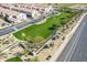 Aerial view of grassy area, landscaping and homes in the lush, green community with nearby shopping and retail at 3855 S Mcqueen Rd # 101, Chandler, AZ 85286