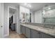 Elegant bathroom with double sinks, granite countertops, and a glass-enclosed shower at 3855 S Mcqueen Rd # 101, Chandler, AZ 85286