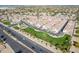 An aerial view showcases a beautiful community featuring well-maintained homes with lush landscaping at 3855 S Mcqueen Rd # 101, Chandler, AZ 85286