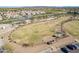 Aerial shot of the dog park featuring a grassy area, trees, and pet exercise equipment at 3855 S Mcqueen Rd # 101, Chandler, AZ 85286