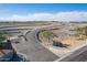 Aerial view of Paseo Vista entrance with signage and scenic desert landscaping and mountain views at 3855 S Mcqueen Rd # 101, Chandler, AZ 85286